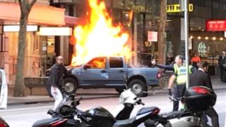 A car on fire at Bourke street
