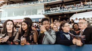 People watch the start of the 2018 editon of the Vodacom Durban July horse race in Durban, on 7 July 2018