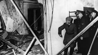 Mussolini and Hitler inspect the wreckage of the conference room after the bomb