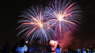 A fireworks light illuminates the sky above the marina of Yas on the third day of the Muslim holiday of Eid Al-Fitr in the Yas Island Marina, Abu Dhabi, in the United Arab Emirates