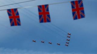 The Royal Air Force Red Arrows fly over Northampton