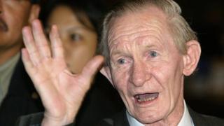 Former US soldier Charles Robert Jenkins waves upon arriving at a Jakarta hotel from North Korea in this 9 July 2004 file photo.