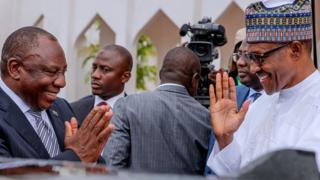 South African President Cyril Ramaphosa (L) and Nigerian President Muhammadu Buhari (R) greet each other at State House in Abuja, Nigeria - Wednesday 11 July 2018