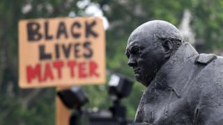 Statue of Churchill in Parliament Square with Black Lives Matter sign