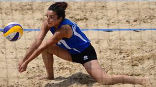 Algerian Kawther Mehani dives for the ball in Cambrils, Spain - Thursday 287 June 2018