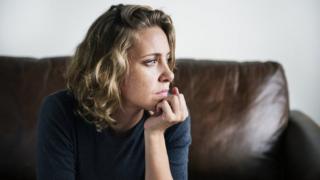 Woman staring at an empty space