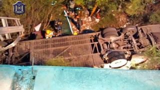 A police photograph showing the overturned bus