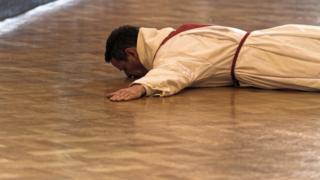 Philip Mulryne prostrate as he was ordained a priest in Dublin on Saturday