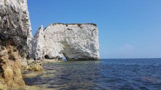 White rocks reflected in the sea