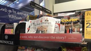 The Daily Telegraph newspaper placed with business and computing magazines in a WH Smith store