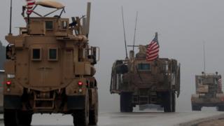 File photo showing US soldier on an armoured personnel carrier in Manbij, northern Syria (30 December 2018)