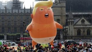 A balloon depicting US President Donald Trump as a baby, flying above Parliament Square, in London, in 2018