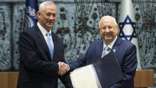 Israeli President Reuven Rivlin (R) and Blue and White Party Leader Benny Gantz attend a nomination ceremony on October 23, 2019 in Jerusalem