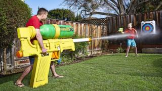 Mark Rober with the largest water pistol.