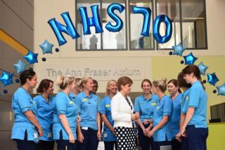 Scotland's First Minister Nicola Sturgeon speaks to NHS staff at the Royal Hospital for Children in Glasgow
