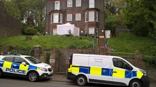 Police vehicles outside house on Hitchin Road, Luton