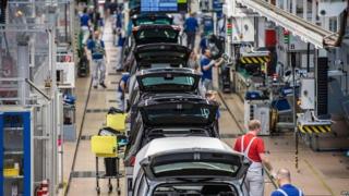 Workers at the Volkswagen factory in Wolfsburg