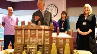 Prince Charles with chocolate model of Highgrove House