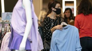 Shoppers wearing face coverings