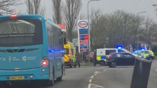 Police vehicles outside of the Esso petrol station