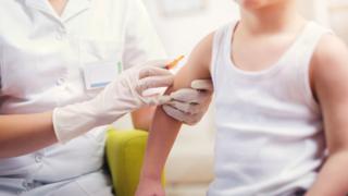 Child getting measles vaccine