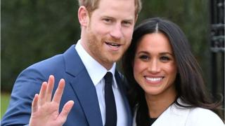 Meghan Markle and Prince Harry pose after engagement