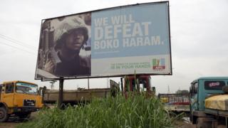 Campaign signboard displayed by the ruling All Progressives Congress (APC) to show its readiness to defeat Boko Haram Islamists on assumption office at Ogijo, Ogun State in southwest Nigeria, on July 3, 2015