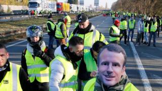 protester in Macron mask