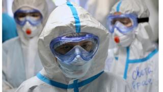 Medical specialists wearing personal protective equipment (PPE) in a Moscow hospital
