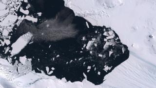 Satellite image of breakup of ice pack at the mouth of the Pine Island Glacier in Antarctica.