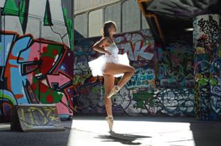 A ballet dancer practises in the sunshine at the Southbank skatepark in London.