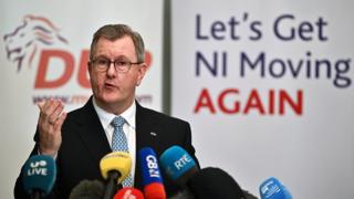 Democratic Unionist Party (DUP) leader Sir Jeffrey Donaldson addresses the media following a meeting with 120 executive members of the DUP on a possible deal to restore the devolved government on 30 January 2024 in Belfast, Northern Ireland