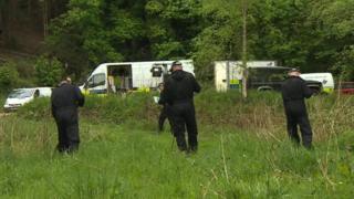 Police search grassland