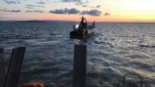 Troon Trent class all-weather lifeboat RNLB Jim Moffat escorting the fishing vessel back to Troon