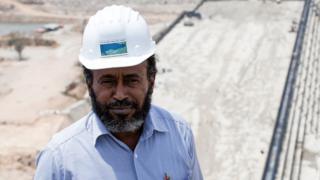   In this photo brief taken on March 31, 2015, Chief Engineer Simegnew Bekele poses during a visit to the Grand Renaissance Dam under construction near the Sudan-Ethiopia border. 