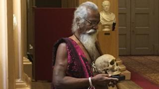 Vedda chief with skull