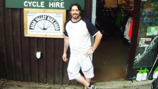Ben Threlfall outside his bike shop