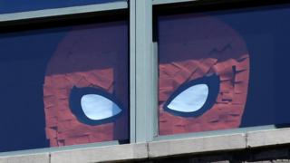 Spiderman face on window