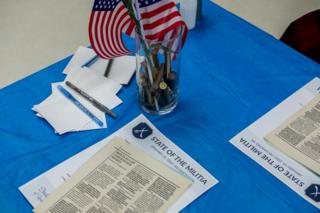 Local militia distributed leafets and used bullets as table decorations