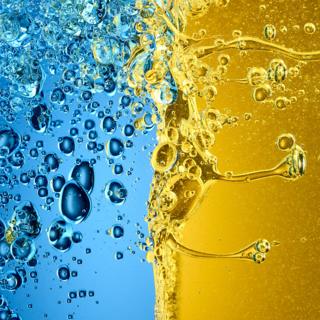 Close up image of oil and vinegar mixing together