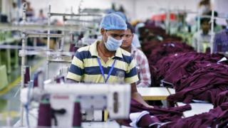Employee working inside a garment factory of Orient Craft Ltd in Gurgaon