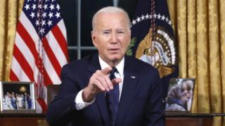US President Joe Biden addresses the nation from the Oval Office of the White House on 19 October 2023 in Washington, DC.