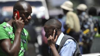   Men using a telephone 