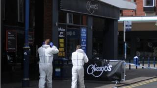 Investigators remain at the scene