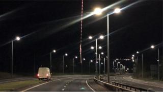 Bar on rope hanging from a footbridge over the A9 in Inverness