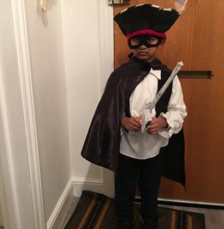 Aron from London, England, dressed up as 'The highway rat'. It is his favourite book. Aron and his mum made a sword, a tail and added a feather to his old pirate hat