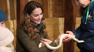 The duchess holds a snake while visiting Ark Open Farm in Newtownards