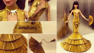 A doll dressed in gold paper