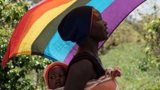 LGBT refugees from South Sudan, Uganda and DR Congo walk on the way to their protest to demand their protection at the office of the United Nations High Commissioner for Refugees (UNHCR) in Nairobi, Kenya, on May 17, 2019. - According to them, they have fled from Kakuma and Dadaab refugee camps in northern Kenya to avoid life threatened incidents and stayed in front of UNHCR office building in Nairobi since January.