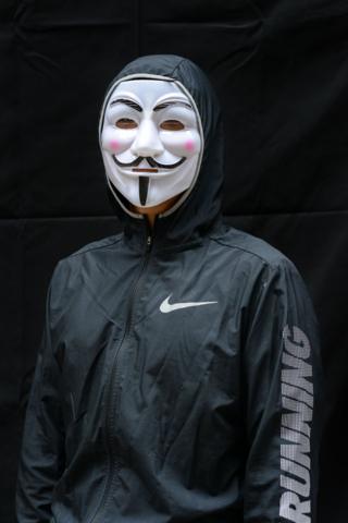 A protester poses for a portrait during the Anti-Totalitarianism march in Causeway Bay, Hong Kong, 29 September 2019